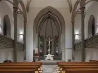 11438